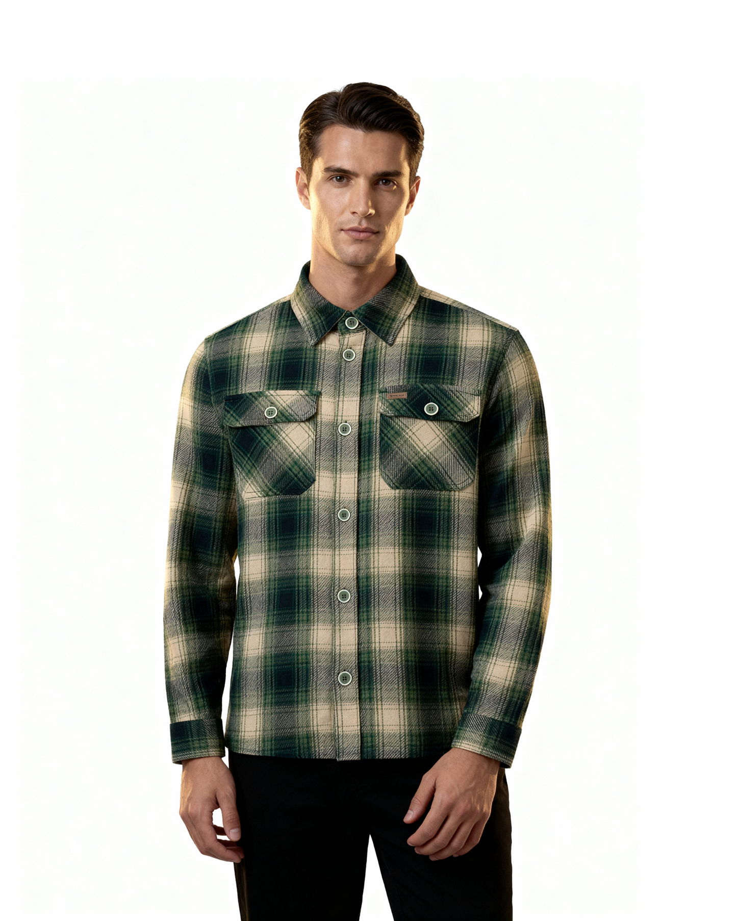 Man wearing a green and beige plaid shirt on a white background